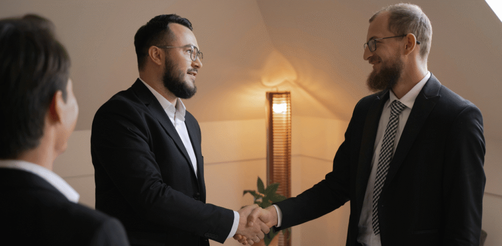 Business deal handshake representing partnership with Seller Edge Capital in business note transactions